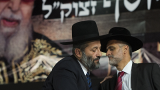 CAPTION: Leader of the ultra orthodox Shas party Aryeh Deri (L) seen with Shas parliament member Eli Yishai during a ceremony a 30 days after the funeral of the late religious spiritual leader of Israel's Sephardic Jews, Rabbi Ovadia Yosef, in Jerusalem on November 5, 2013. Photo by Yonatan Sindel/Flash90